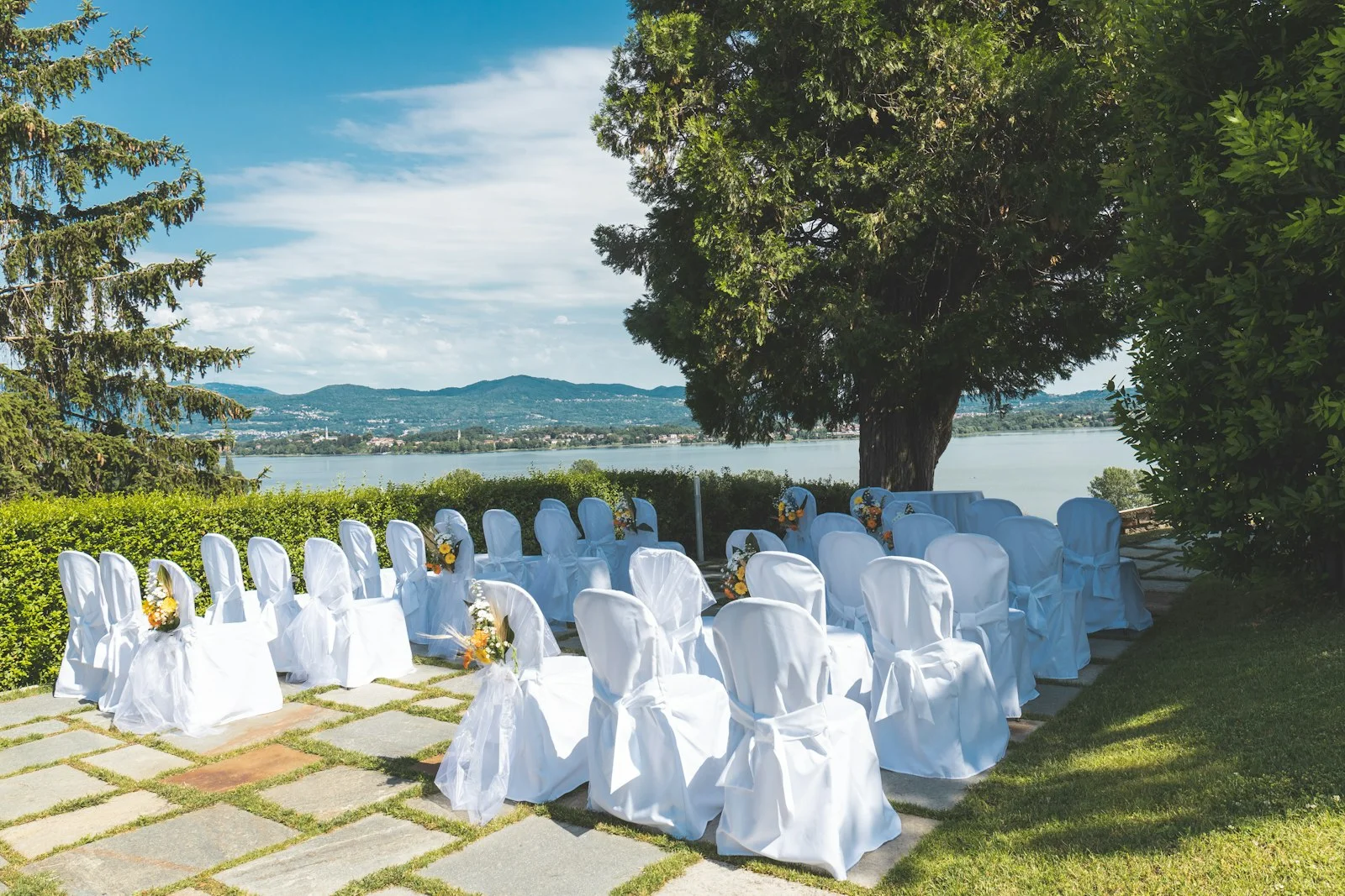 Italian wedding ceremony set up in a lakeside villa garden