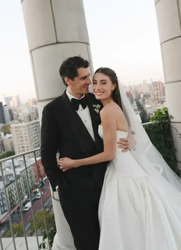 Andy Lee in a black tuxedo and Bec Harding in a strapless gown on the Nine Orchard rooftop above Manhattan | Wedded Wonderland