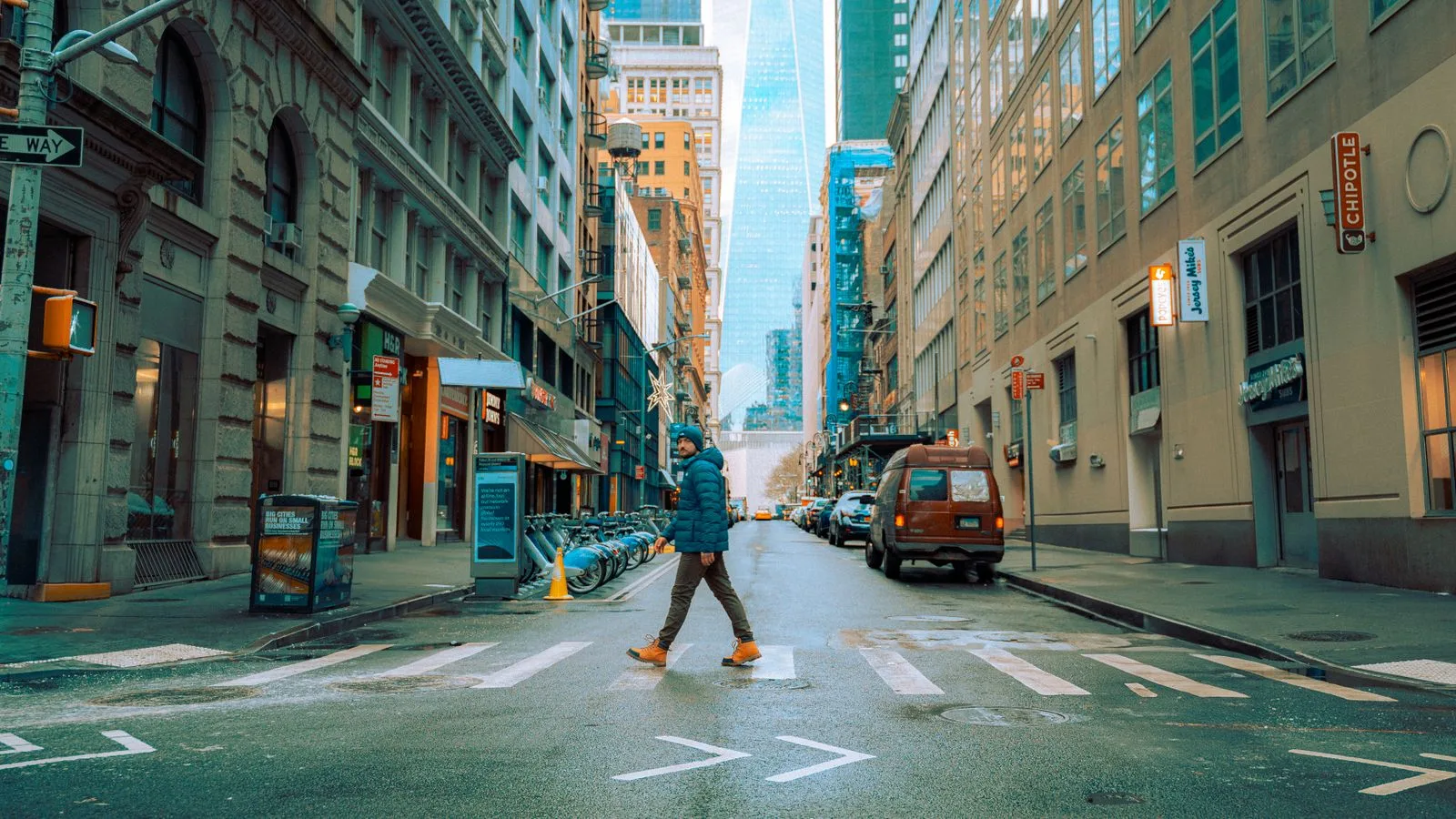 A man crossing a downtown Manhattan street, for a New York wedding for US residents | Wedded Wonderland