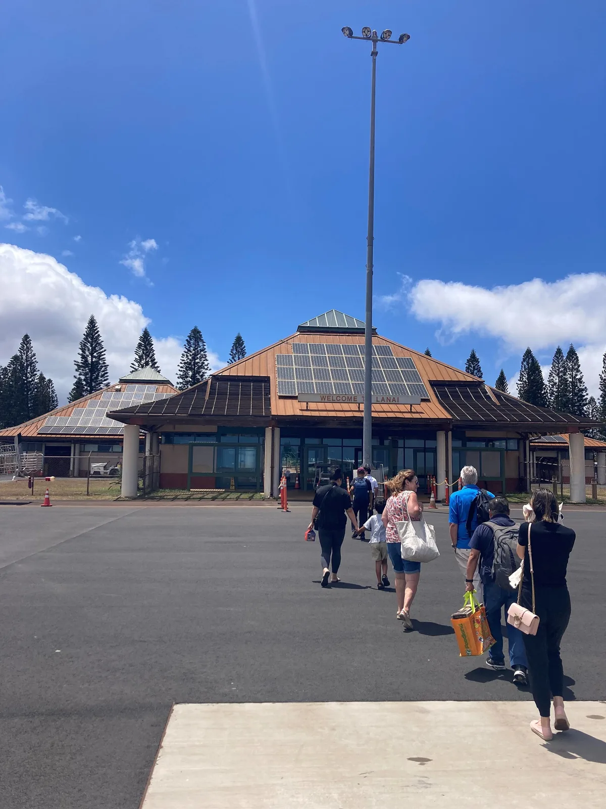 Passengers walking across the tarmac to the terminal at Lanai Airport | Wedded Wonderland