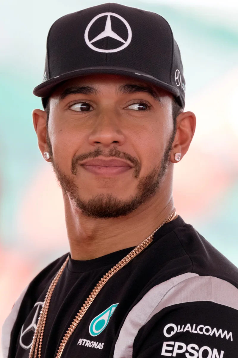 Formula 1 driver Lewis Hamilton in a Mercedes team cap | Wedded Wonderland