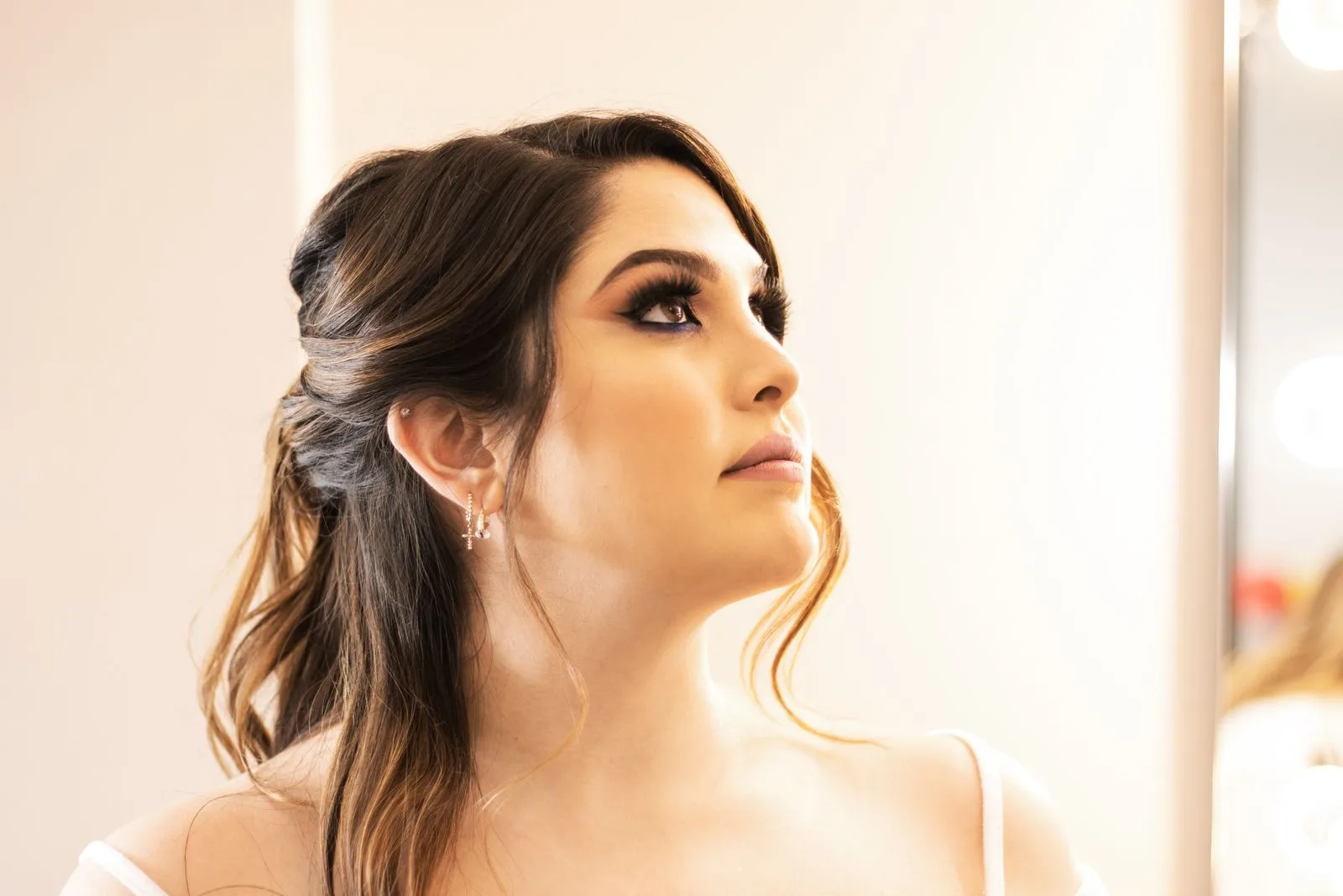 A close-up of a soft glam makeup look with defined lashes and a neutral lip, not a bridal booking | Wedded Wonderland